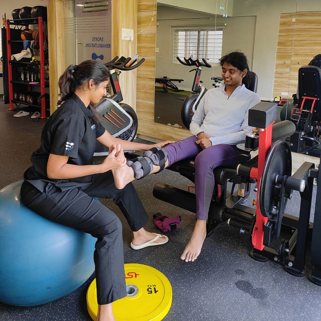 Physiotherapist assisting a patient with rehabilitation exercise at Flexability Physiotherapy Clinic